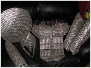 You can learn how to make this pull tab armor at Martha Stewart Living in the Beer Can Crafts for the Armageddon section. It's a good thing.