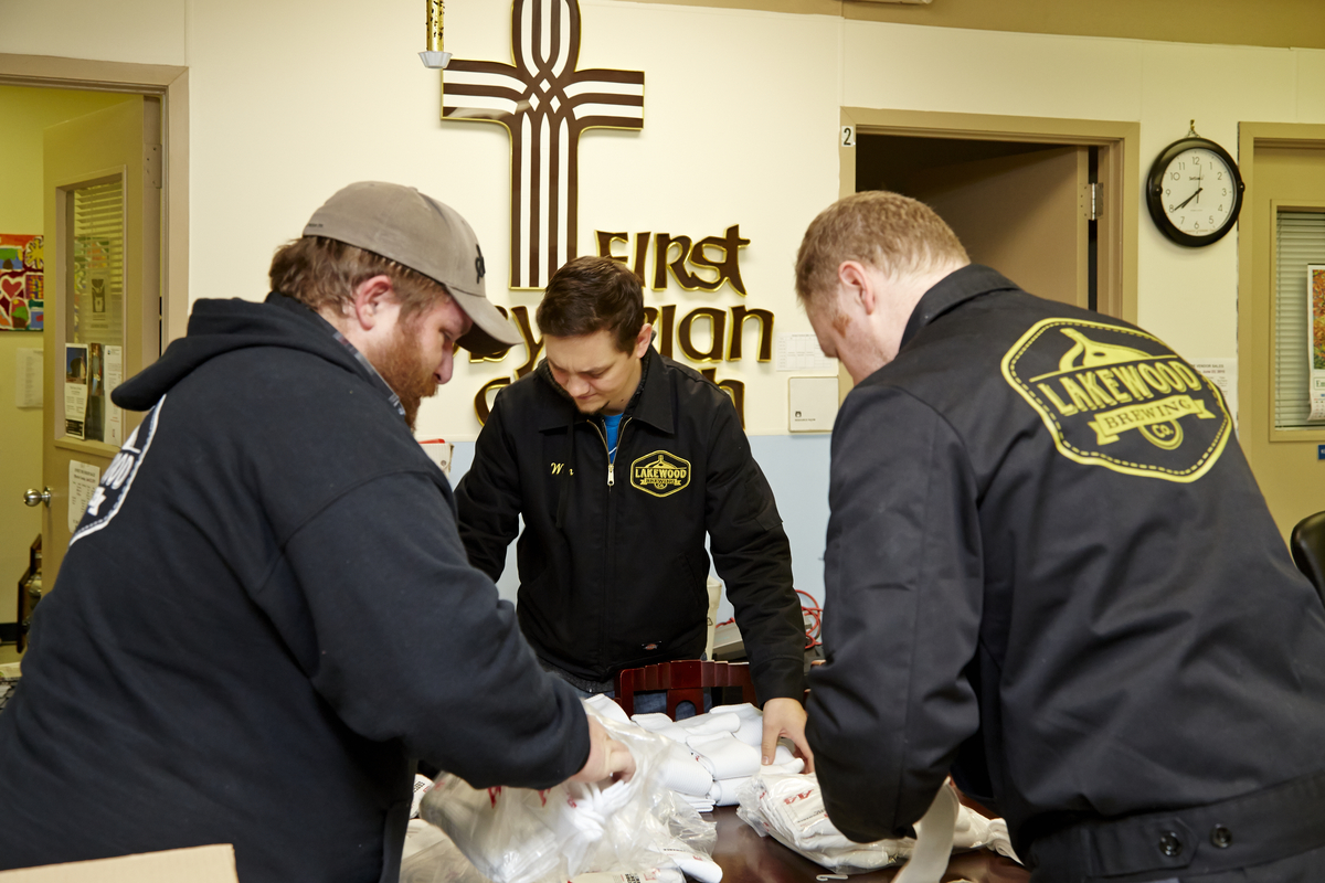 Wim Bens (center) at the Lakewood sock donation