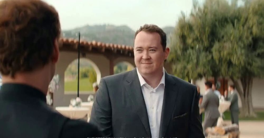 Shane Gillis at open air wedding reception attempting to order a Bud Light beer.