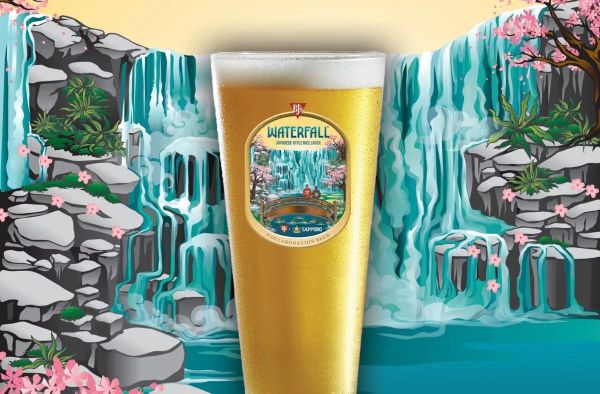 A glass of light-colored Waterfall Japanese Style Rice Lager beer set against a stylized illustration of blue waterfalls and cherry blossoms."
