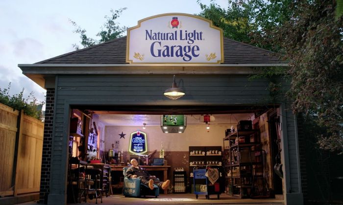 Natural Light Garage with branded signage, beer gear and a sports-viewing setup.