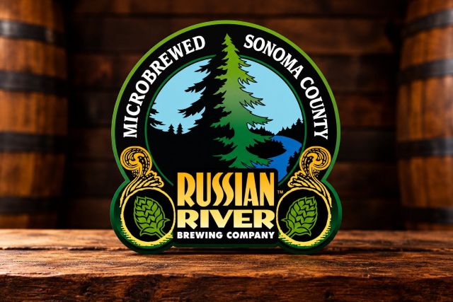 Russian River Brewing Company logo against a warm wooden brewery backdrop with beer barrels.